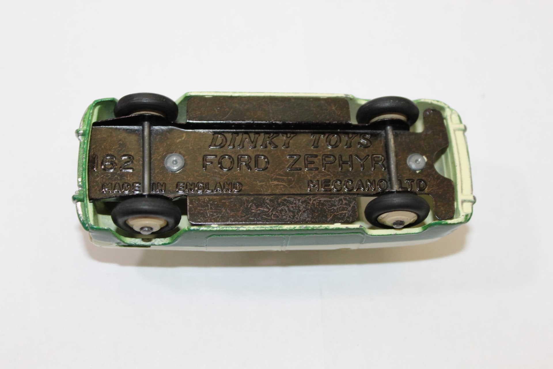 Vintage Dinky Toys 162 Ford Zephyr model in green and cream color.
