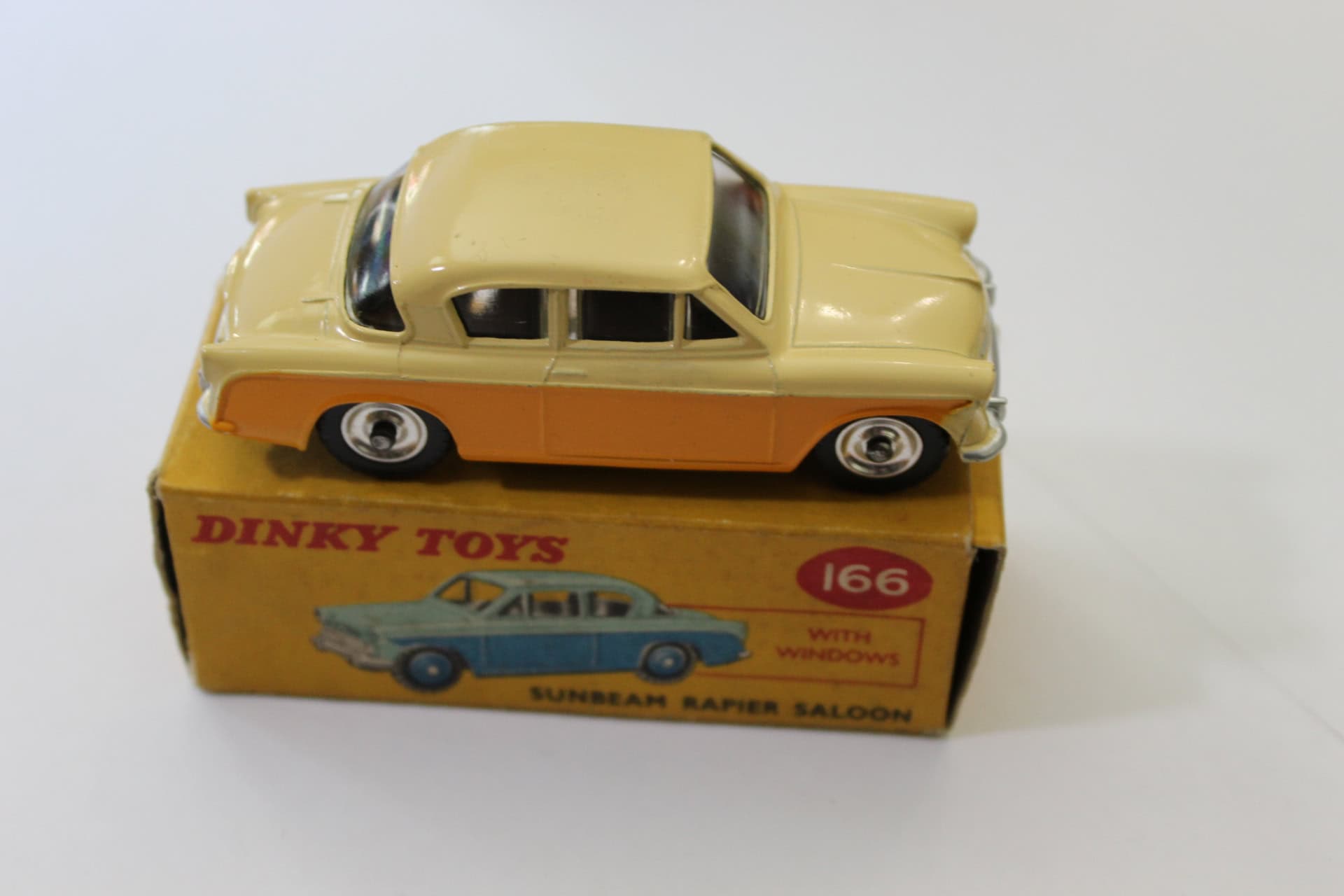 Dinky Toys 166 Sunbeam Rapier model car with windows and original box.