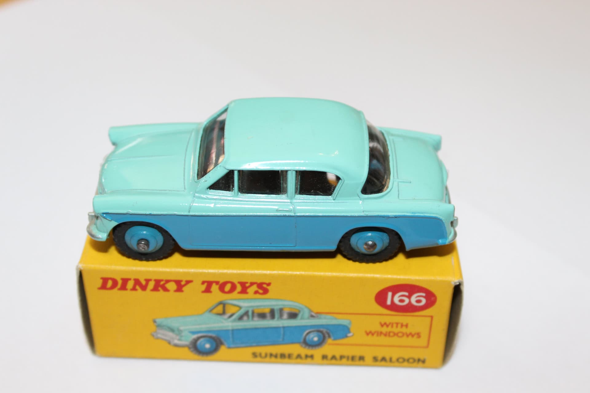 Dinky Toys 166 Sunbeam Rapier diecast model with windows, vintage toy car.