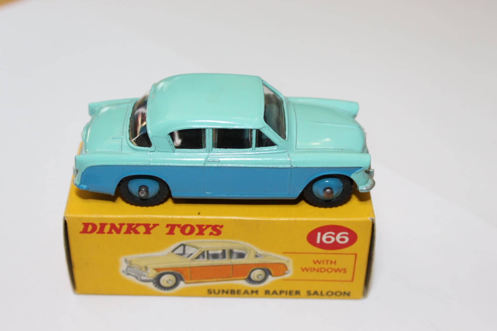 Dinky Toys 166 Sunbeam Rapier diecast model on original box, vintage toy car.