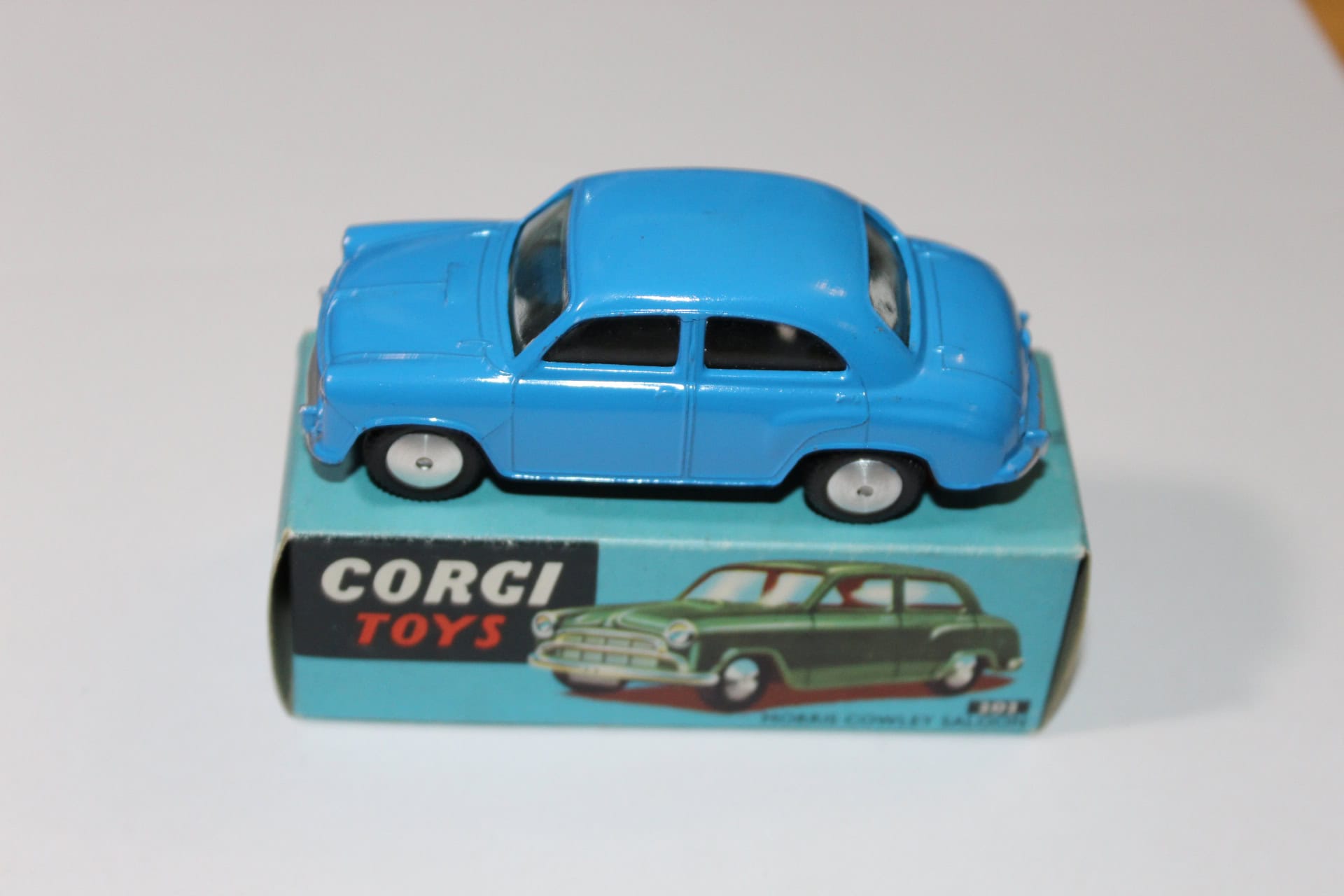 Vintage Corgi Toys 202 blue Morris Cowley diecast model car for collectors.