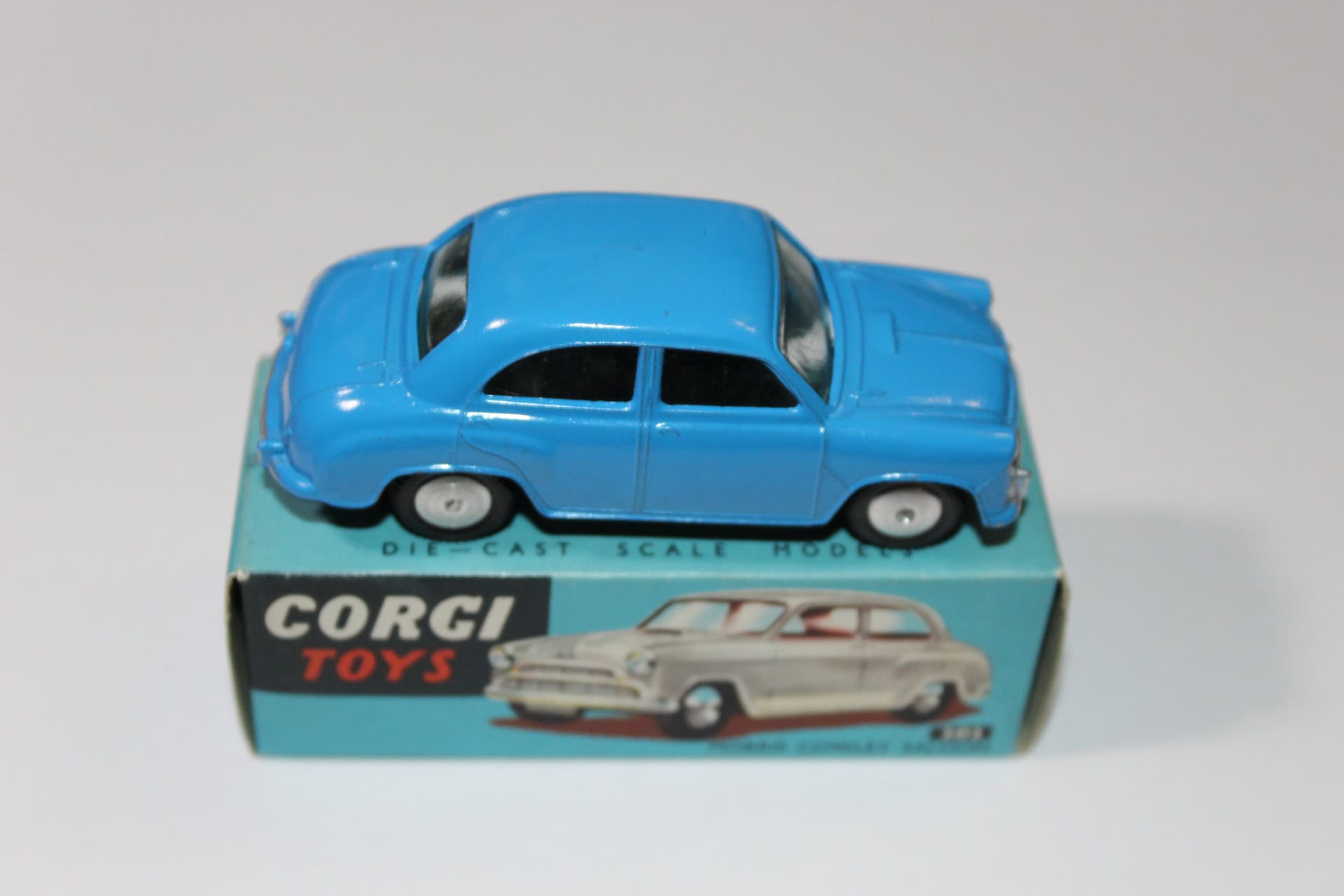 Corgi Toys 202 blue Morris Cowley diecast model car on packaging box.