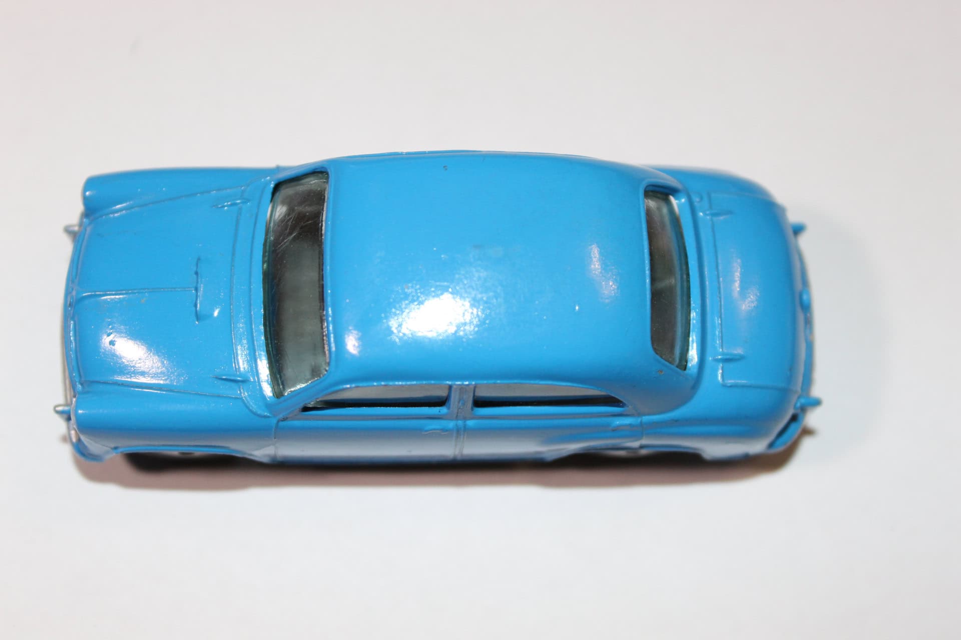 Corgi Toys 202 blue Morris Cowley diecast model car on white background.