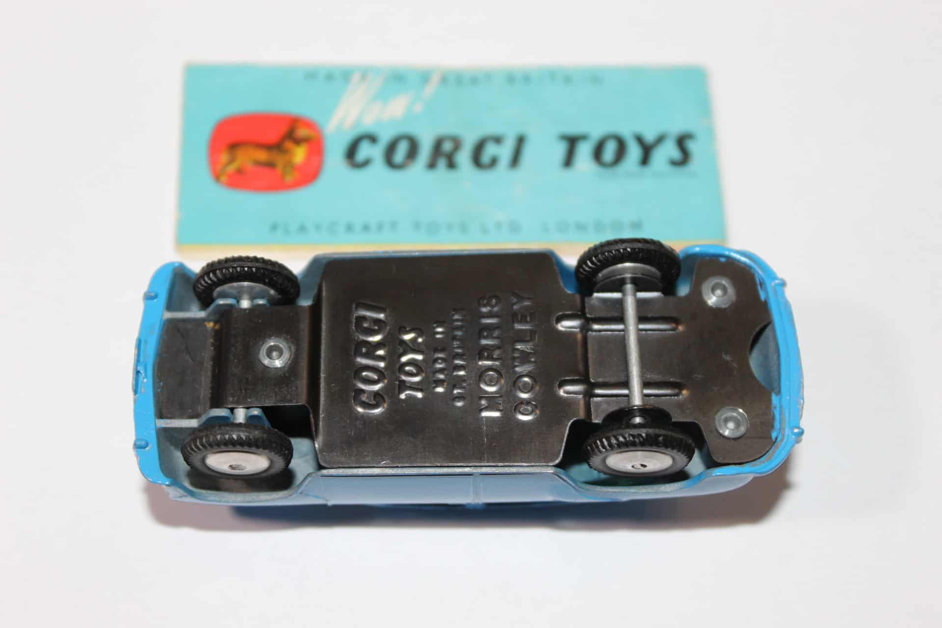 Vintage Corgi Toys 202 blue Morris Cowley diecast model car with packaging.