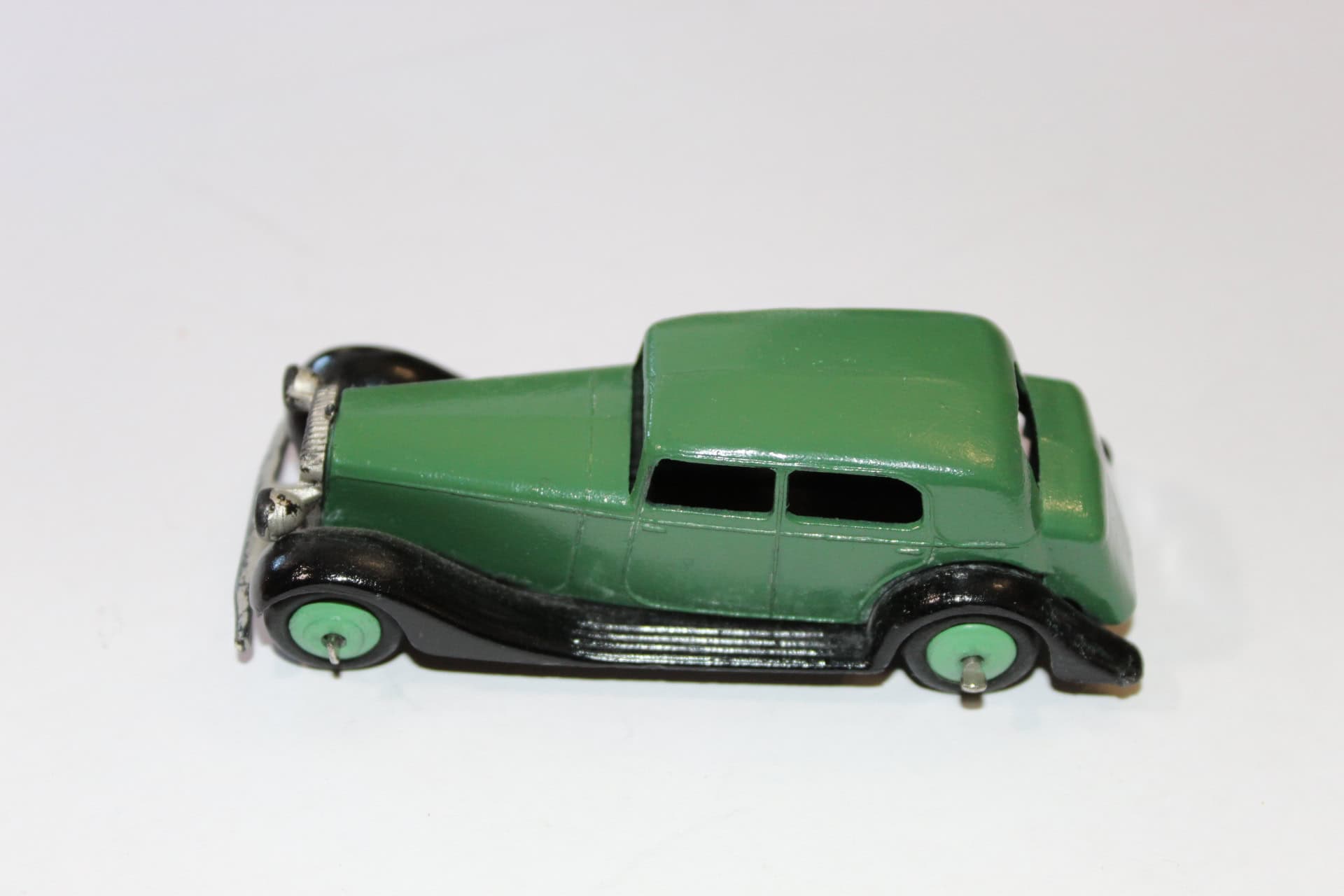 Vintage Corgi Toys 236 Motor School Car model in green with black details.