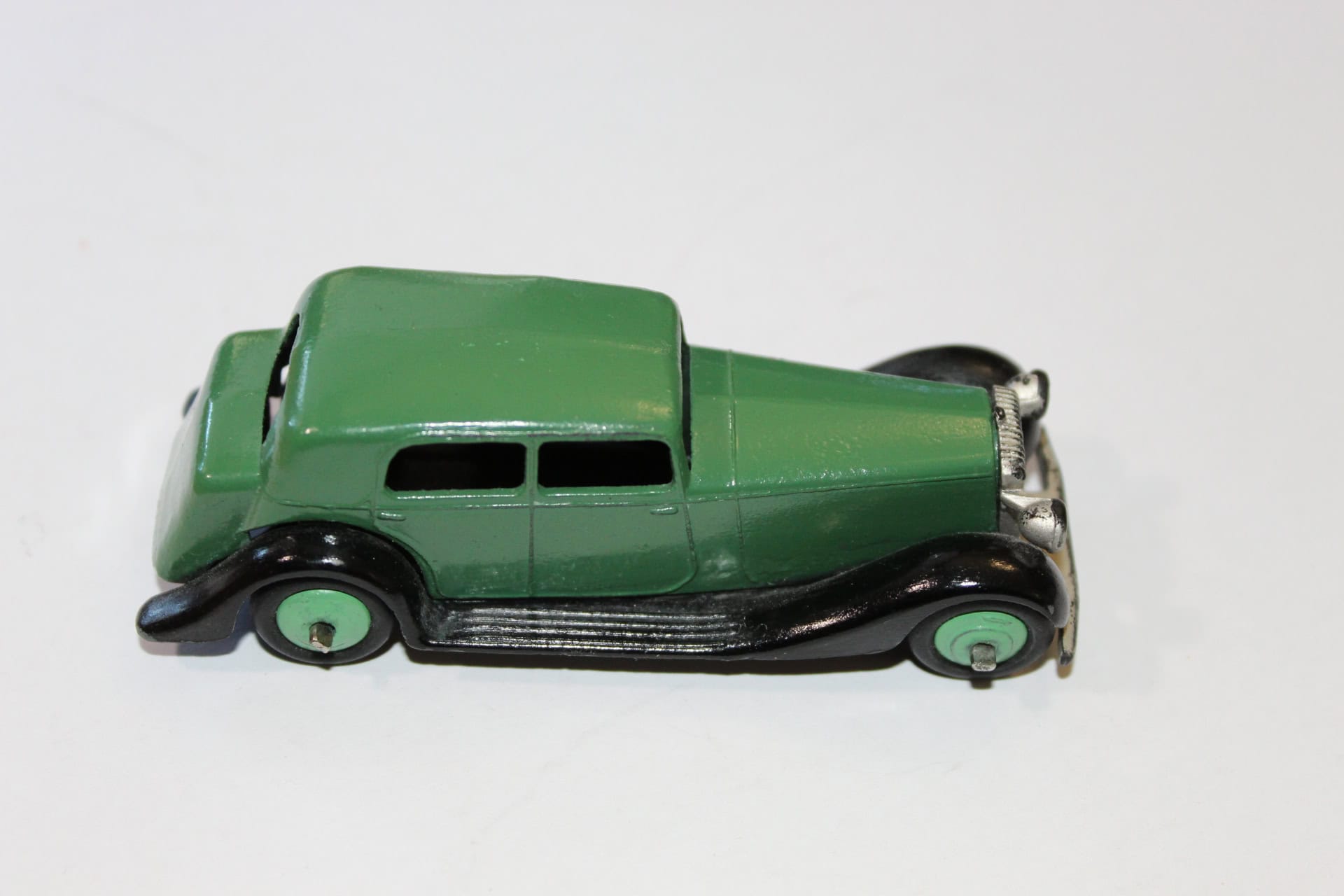 Vintage Corgi Toys 236 motor school car model in green and black.