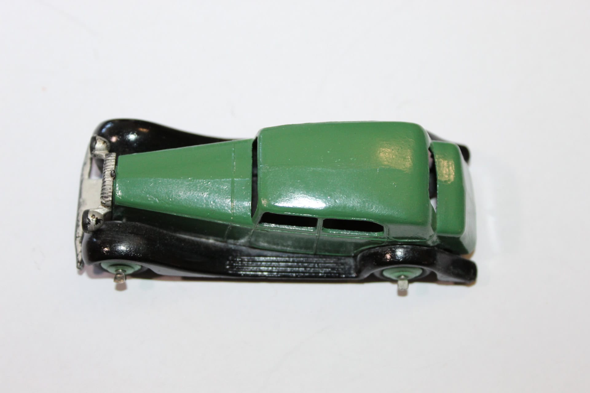 Vintage Corgi Toys 236 Motor School Car diecast model, green and black collectible vehicle.