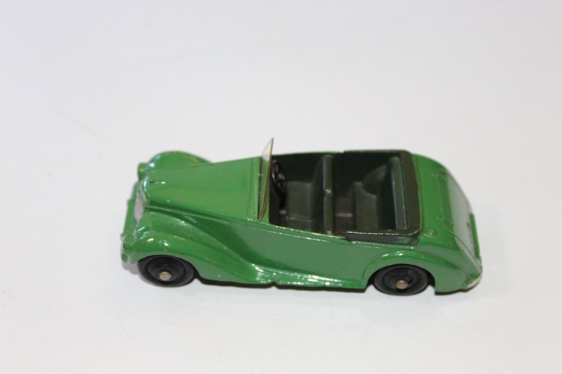 Vintage Corgi Toys 236 Motor School Car diecast model, green with black interior.