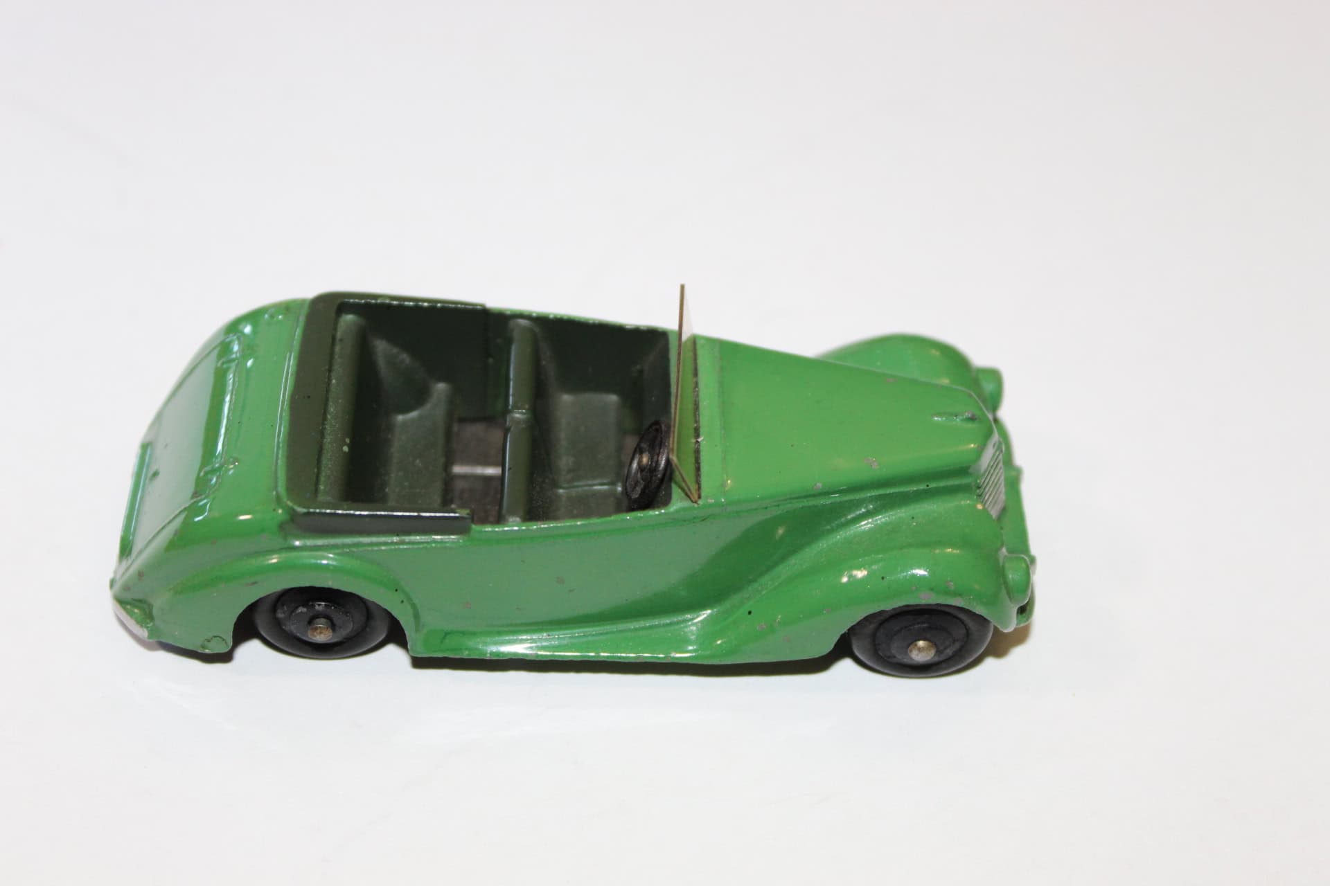 Vintage green Corgi Toys 236 motor school car model for collectors.