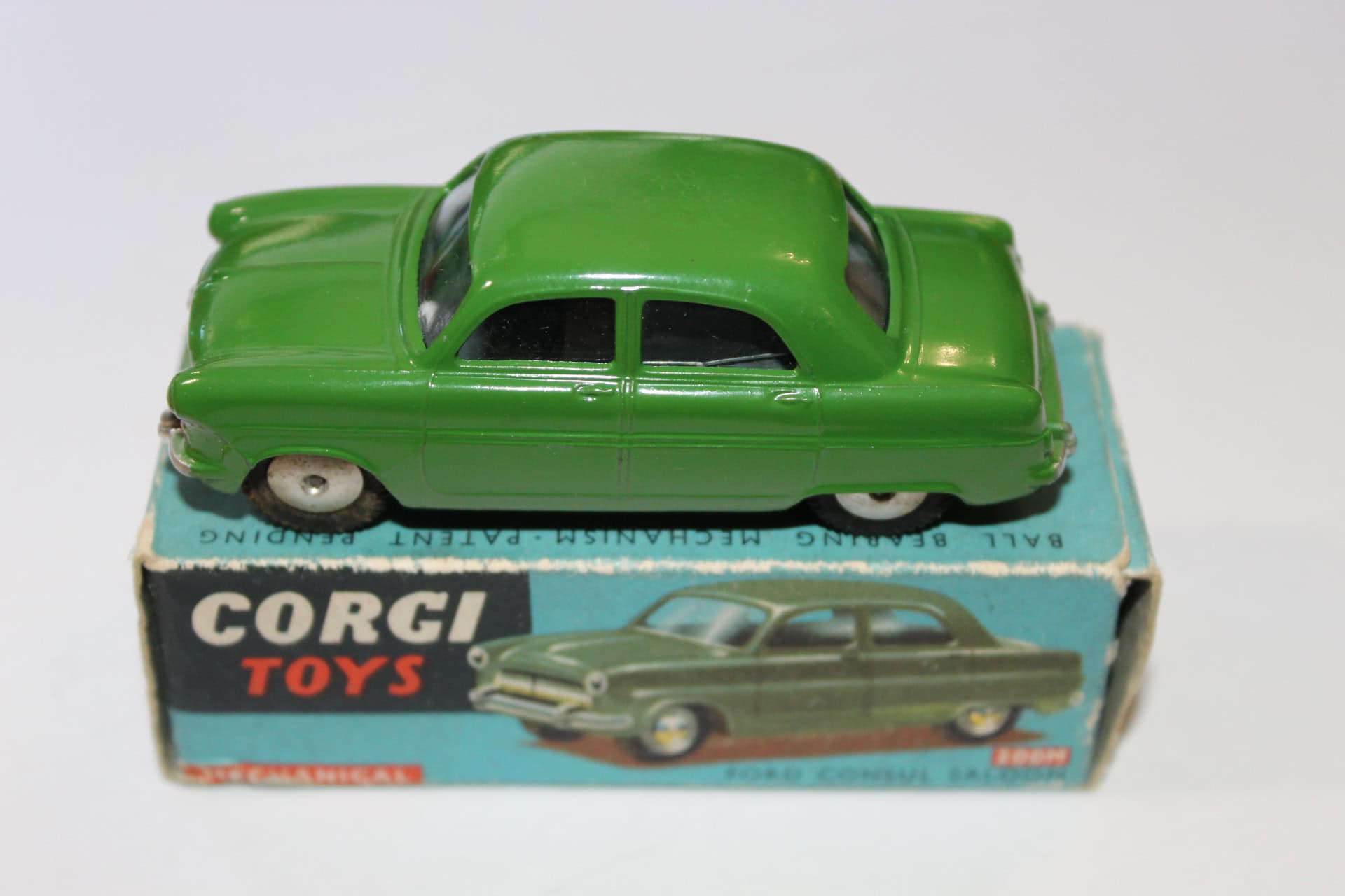 Vintage green Corgi Toys 236 Motor School Car model on box.