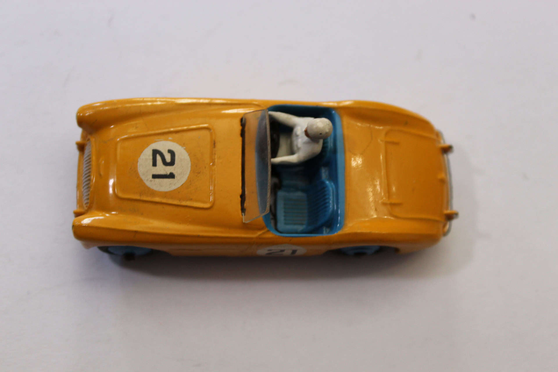 Vintage Dinky Toys 109 Austin Healey model car with driver figure.