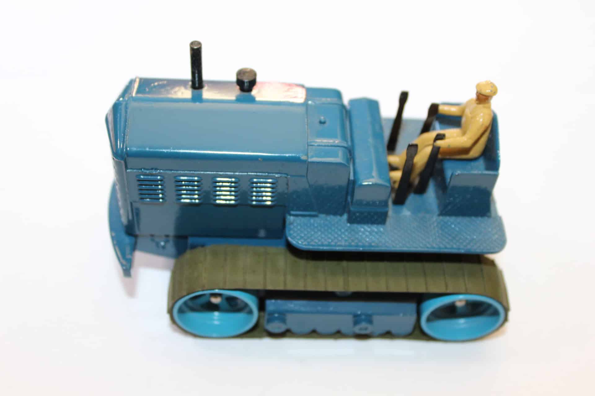 Vintage Dinky Toys 563 heavy tractor with driver figure, collectible model for enthusiasts.