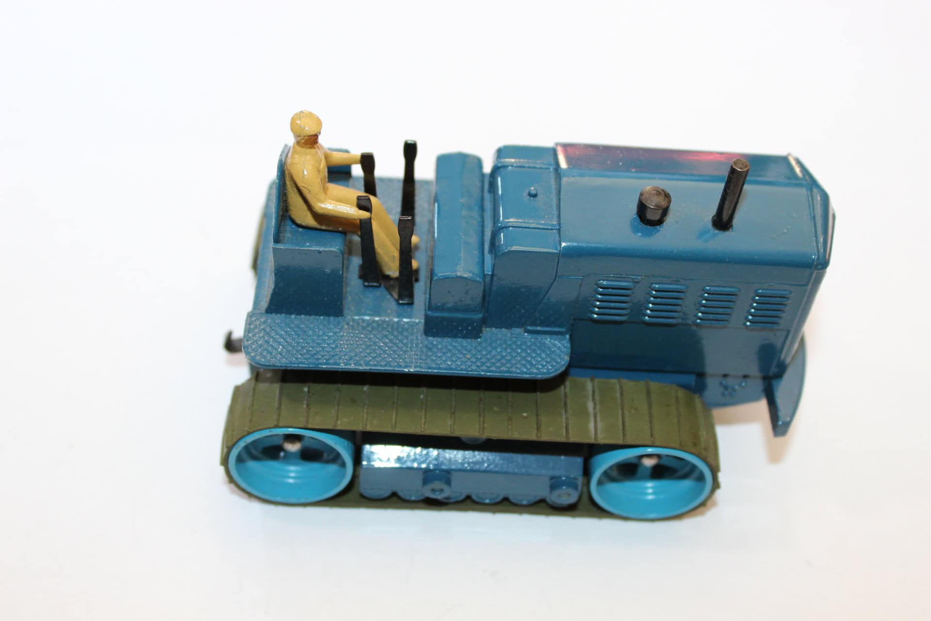 Vintage Dinky Toys 563 heavy tractor with driver figure, collectible model for diecast enthusiasts.
