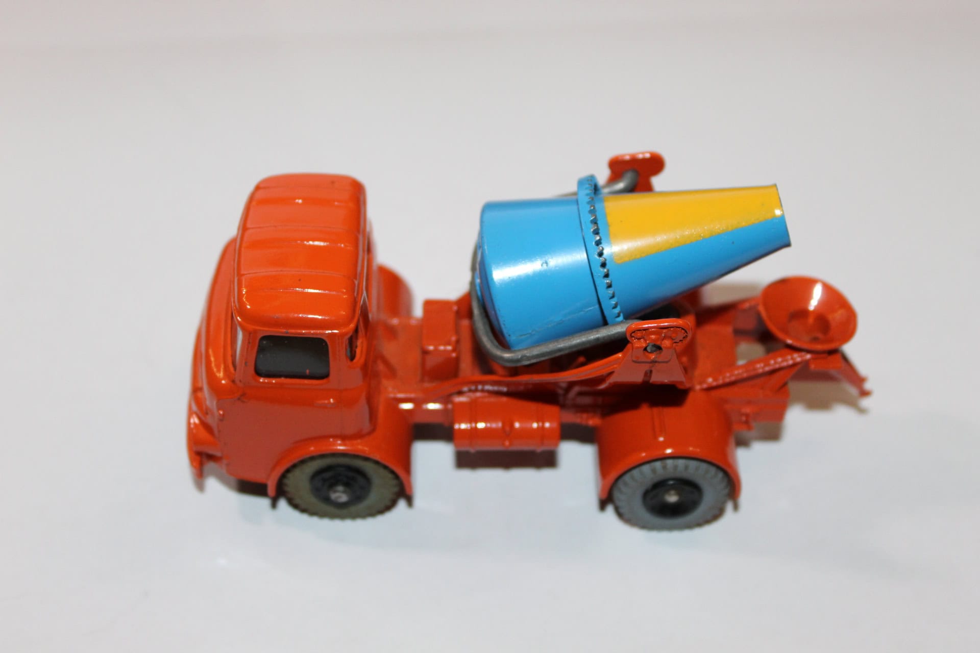 Vintage Dinky Toys 960 lorry with mounted concrete mixer in orange and blue.