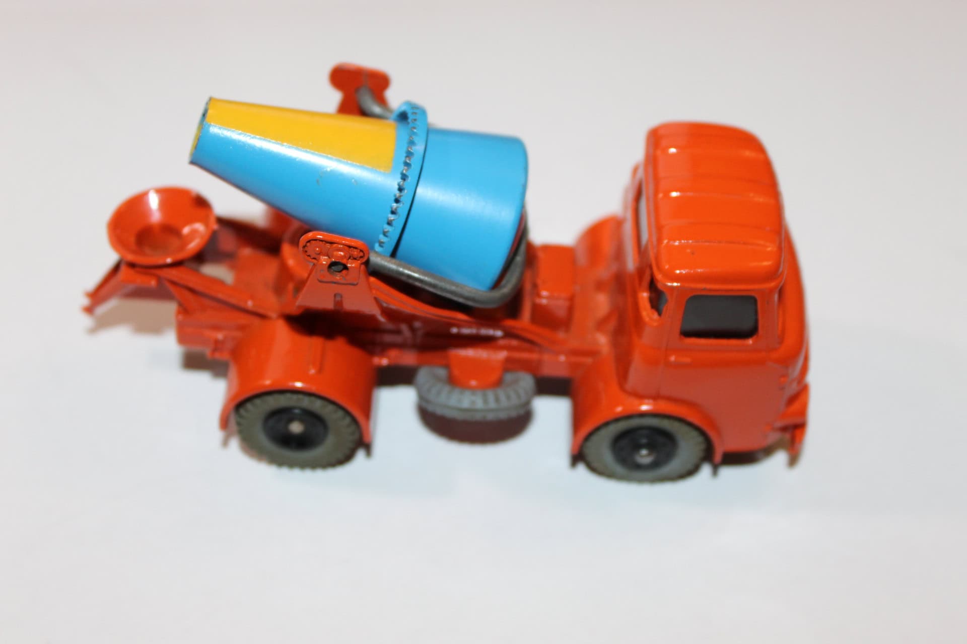 Vintage Dinky Toys 960 lorry with mounted concrete mixer in orange and blue.