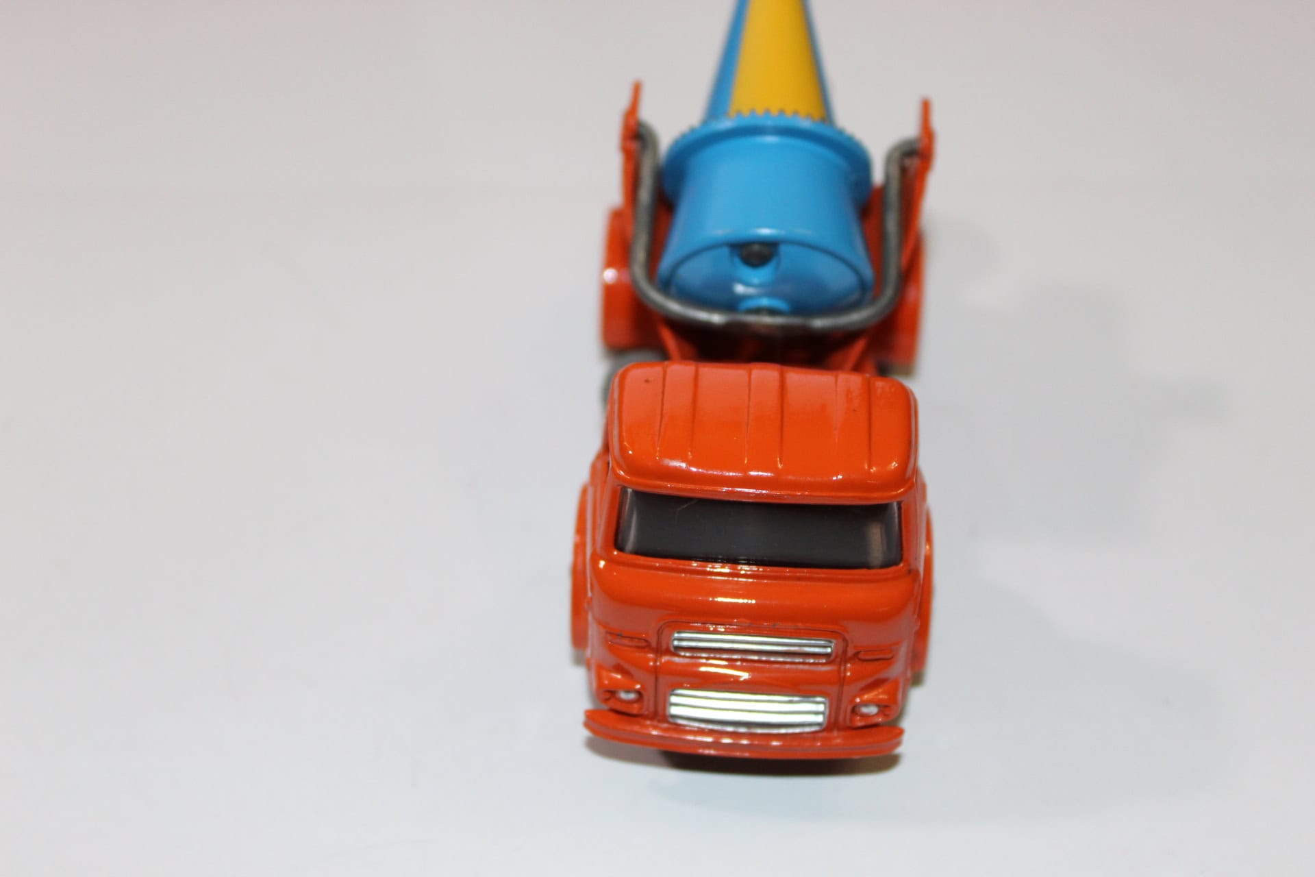 Vintage Dinky Toys 960 lorry carrying a blue concrete mixer with yellow cone.