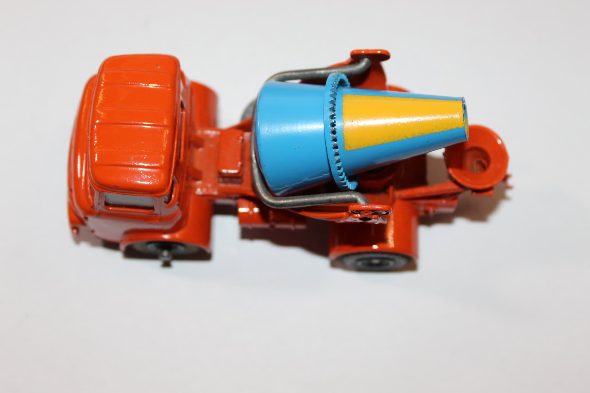 Vintage Dinky Toys 960 concrete mixer truck model with orange and blue details.