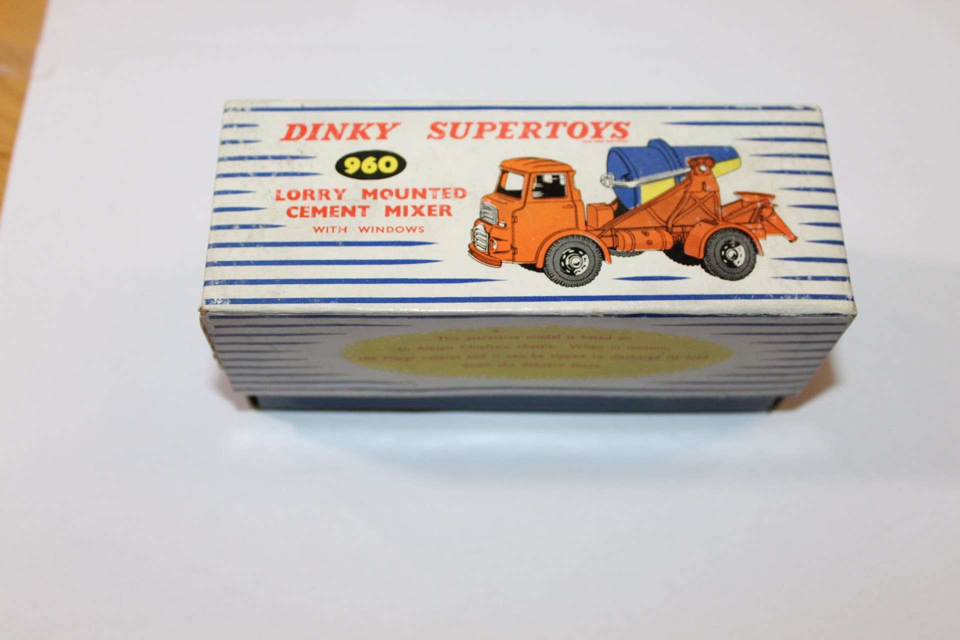 Detailed Dinky Toys 960 lorry mounted concrete mixer with orange cab and blue drum.