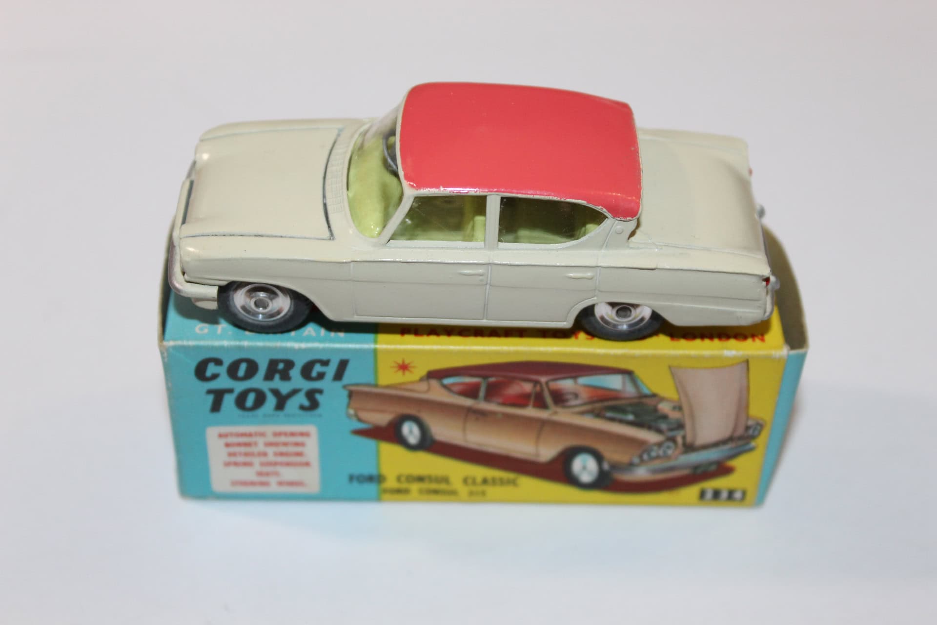 Vintage Corgi Toys 234 Ford Consul Classic diecast model car with red roof, displayed on its origina.