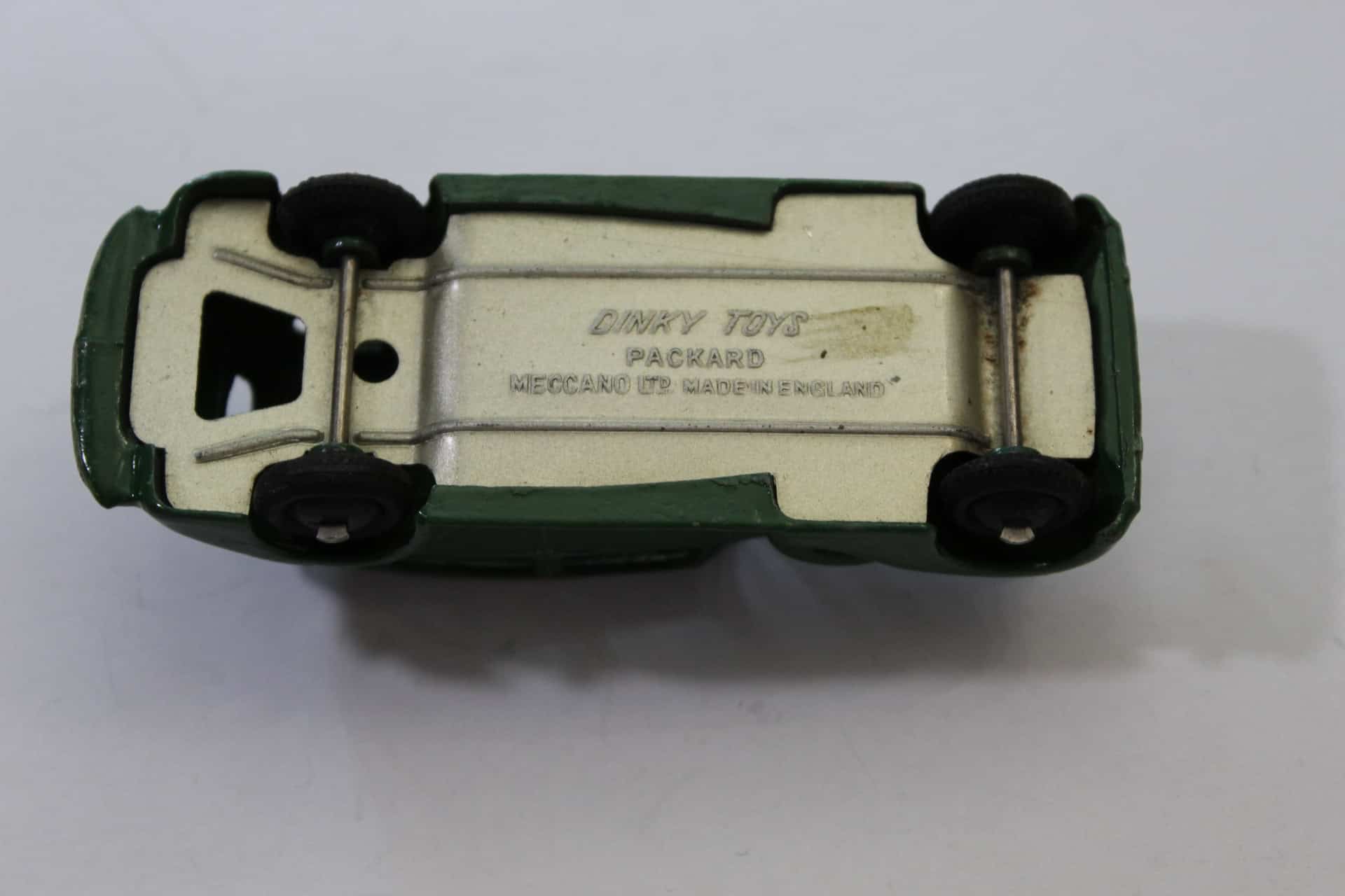 Vintage Corgi Toys 223 Chevrolet State Patrol diecast model car, underside view.
