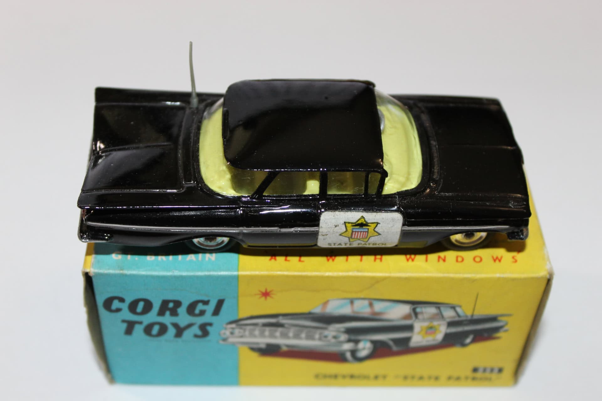 Corgi Toys 223 Chevrolet 'State Patrol' diecast police car model with black and yellow paint.