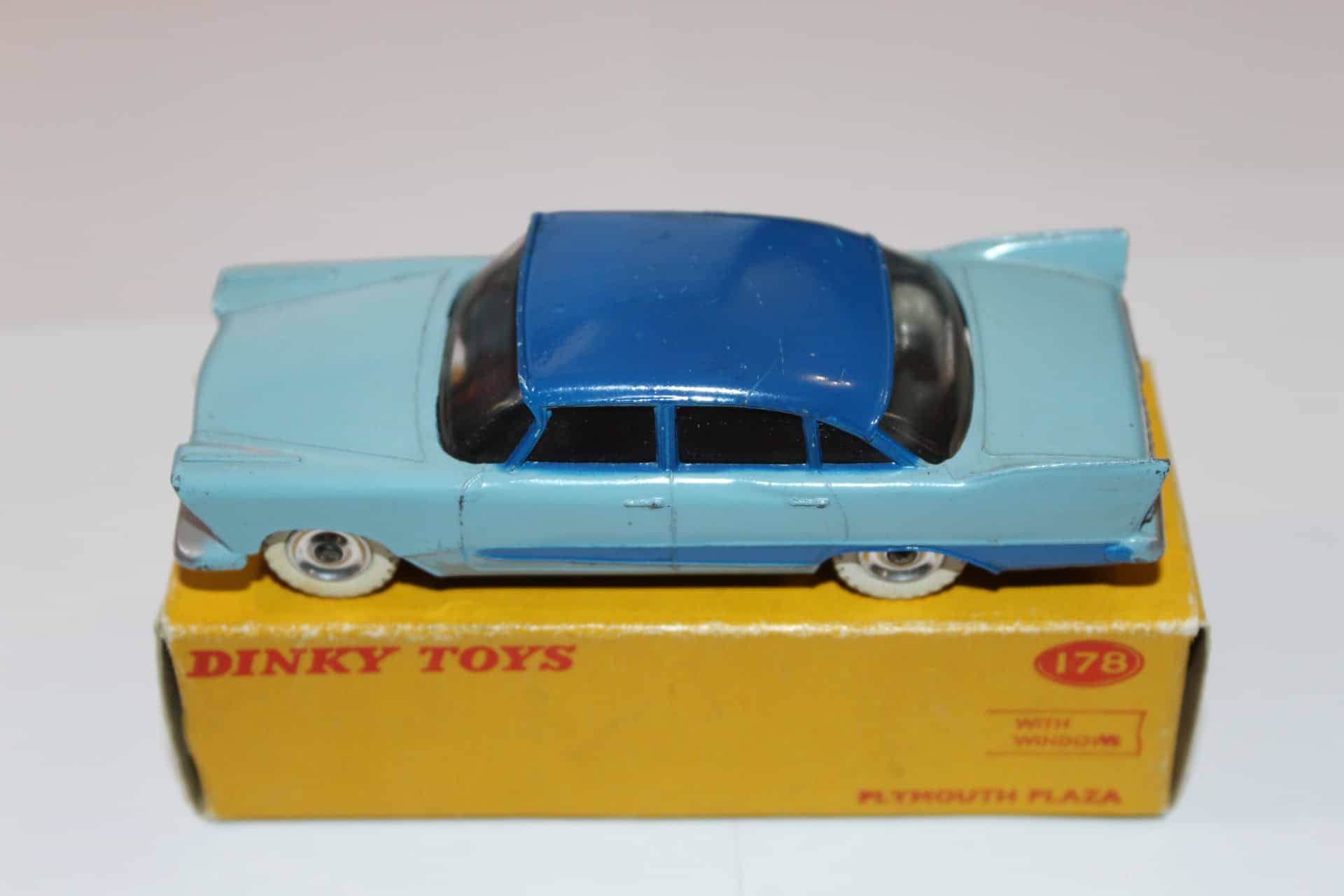 Dinky Toys 178 Plymouth Plaza diecast model car on yellow box, vintage collectible toy.