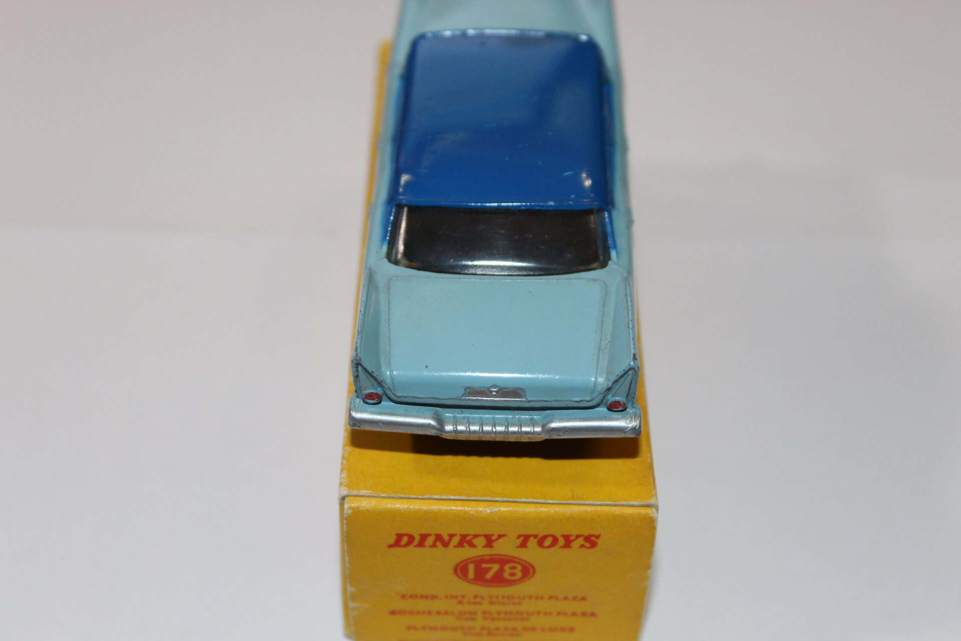 Vintage Dinky Toys 178 Plymouth Plaza diecast model car on packaging.