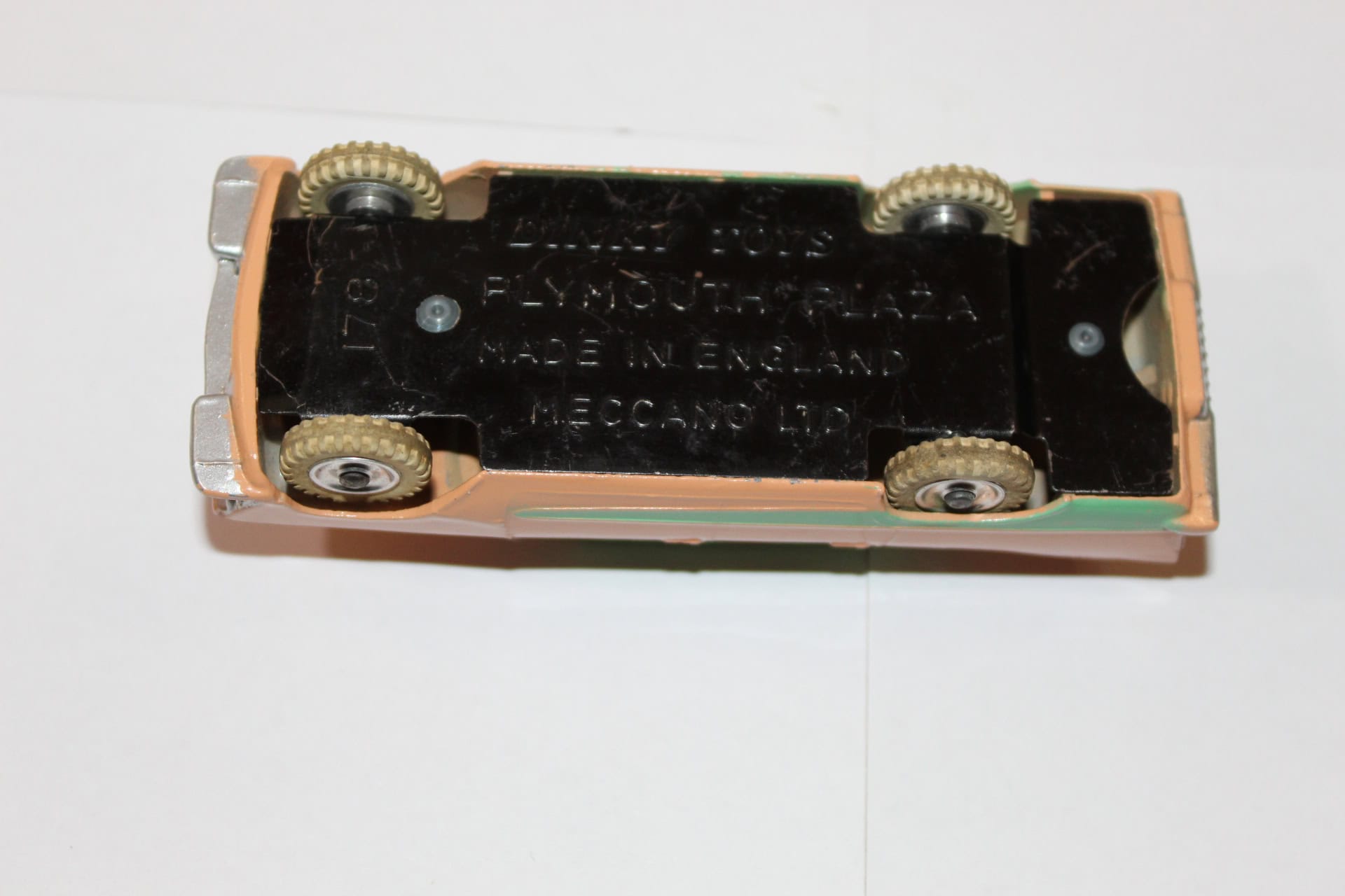 Vintage Dinky Toys 178 Plymouth Plaza diecast model car, underside view.