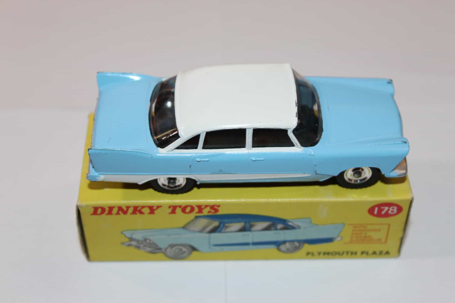 Dinky Toys 178 Plymouth Plaza diecast model car on its original box, vintage toy collectible.