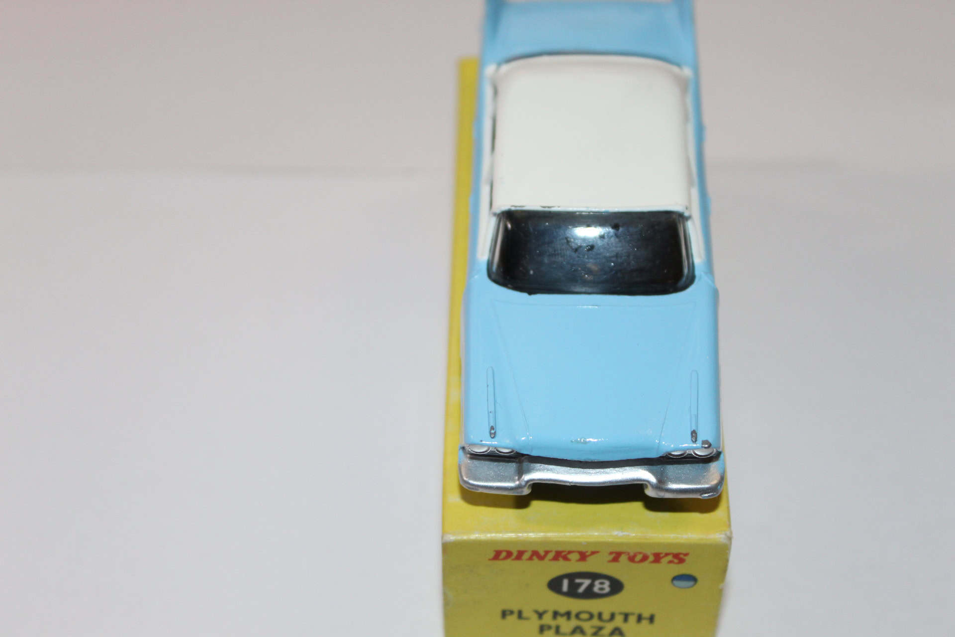 Vintage Dinky Toys 178 Plymouth Plaza diecast model car, blue and white, on original packaging.