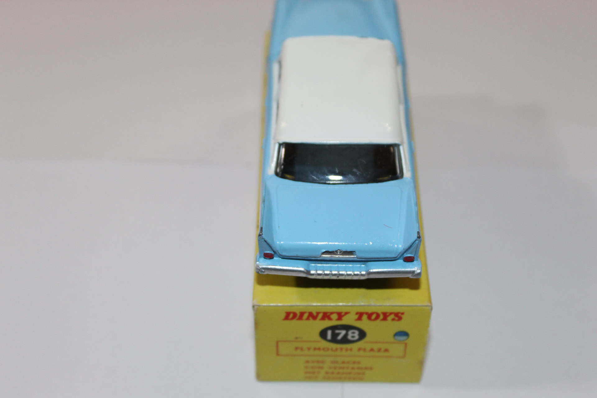 Dinky Toys 178 Plymouth Plaza diecast model car on its original box, vintage collectible.