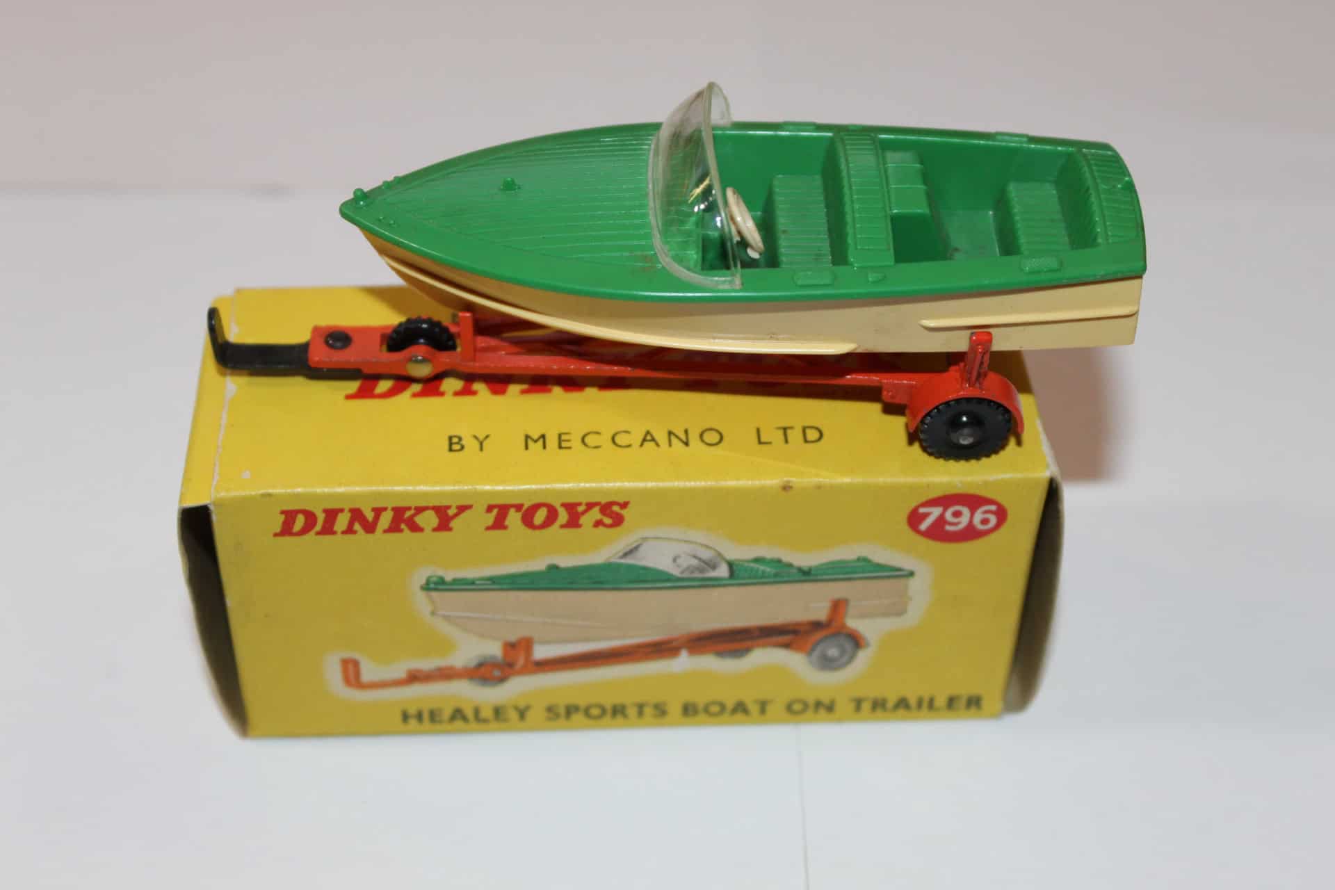 Vintage Dinky Toys 796 Healey Sports Boat model on trailer, displayed on its original box.