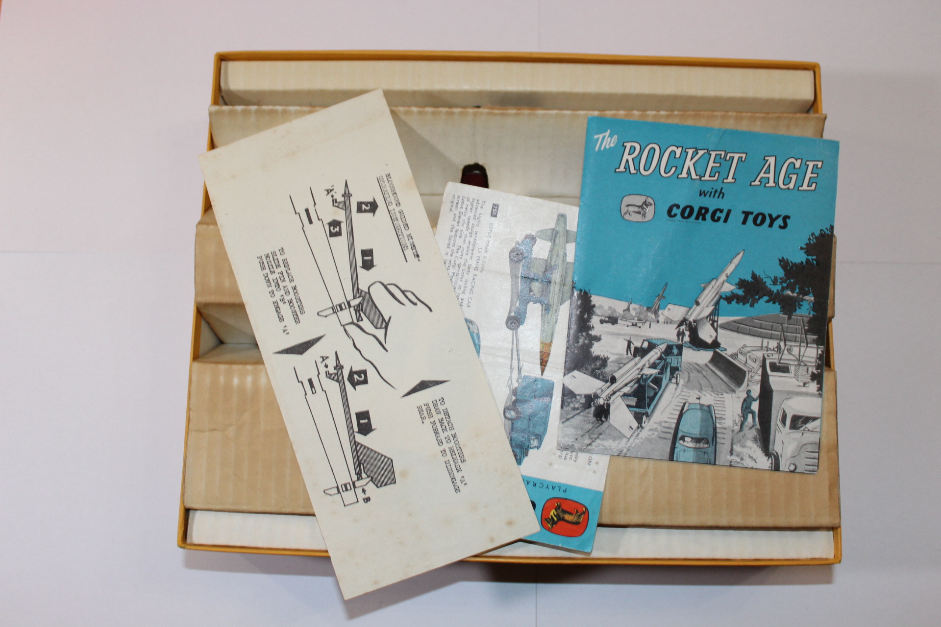 Vintage Corgi Toys Rocket Age gift set with instruction manual and comic book.