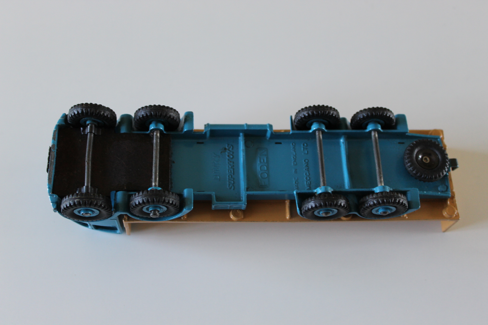 Vintage diecast blue truck toy, collectible model vehicle for enthusiasts.
